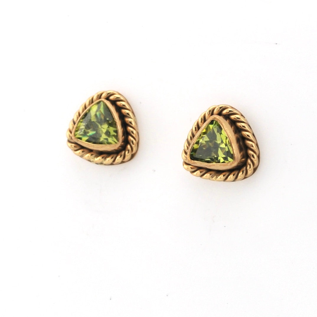 Pair of gold-trimmed green gemstone earrings on a white background