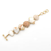 Bracelet with shell-shaped beads on a white background