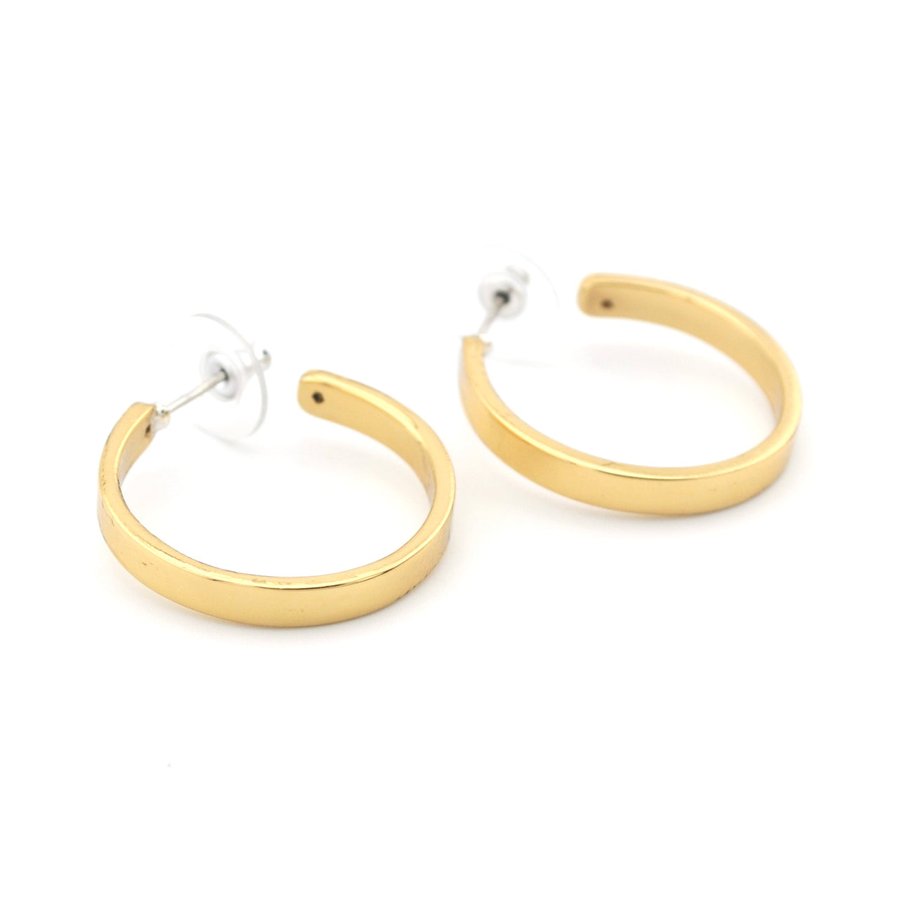Gold hoop earrings on a white background