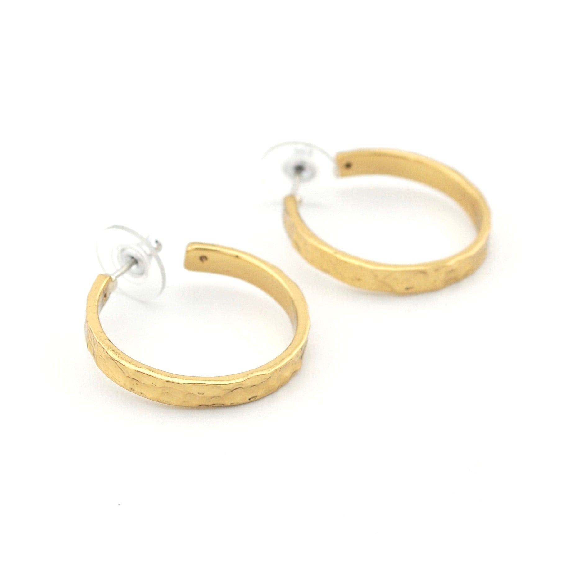Gold hoop earrings on a white background