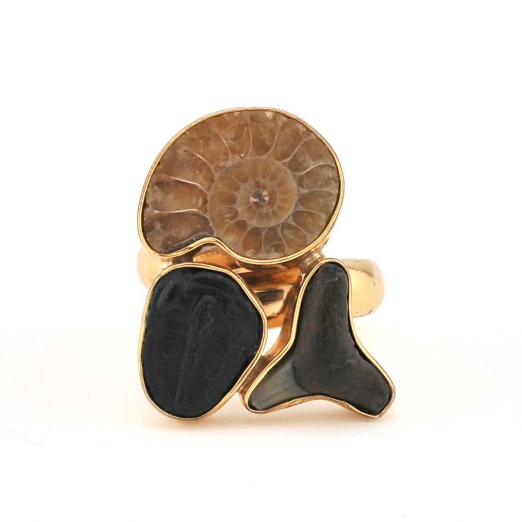 Ring with fossil design on a white background
