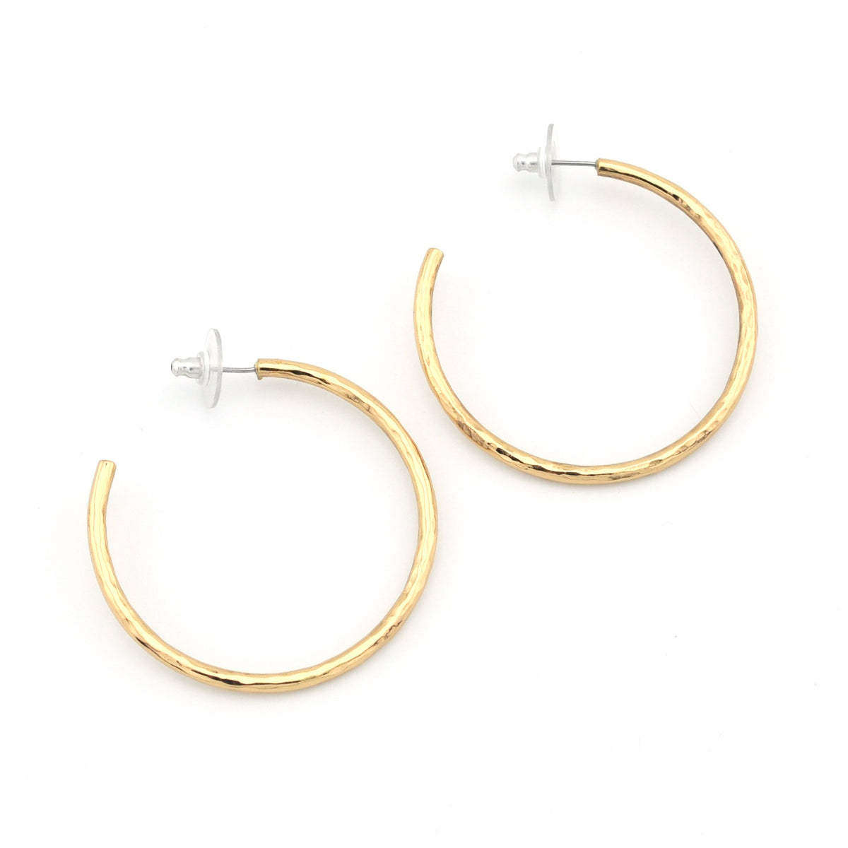 A pair of gold hoop earrings with a textured, hammered finish and silver-tone posts, displayed on a clean white background.