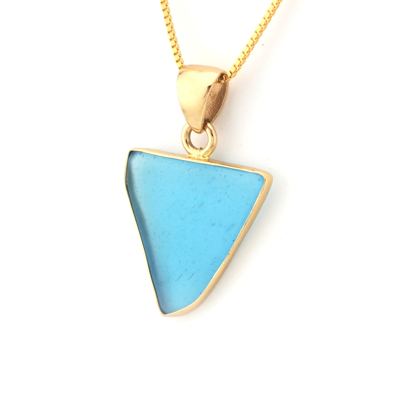 Gold necklace with a blue triangular pendant on a white background