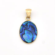 Gold pendant with a blue and green marbled stone on a white background