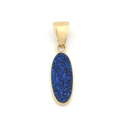 Gold pendant with a blue druzy stone on a white background