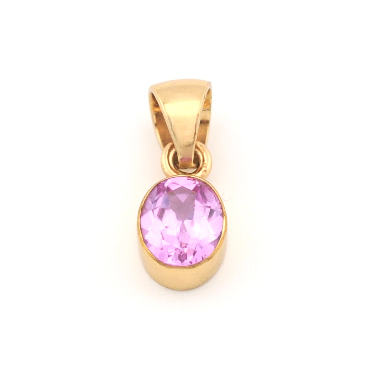 Gold pendant with a pink gemstone on a white background