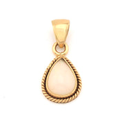 Gold pendant with a white stone on a white background