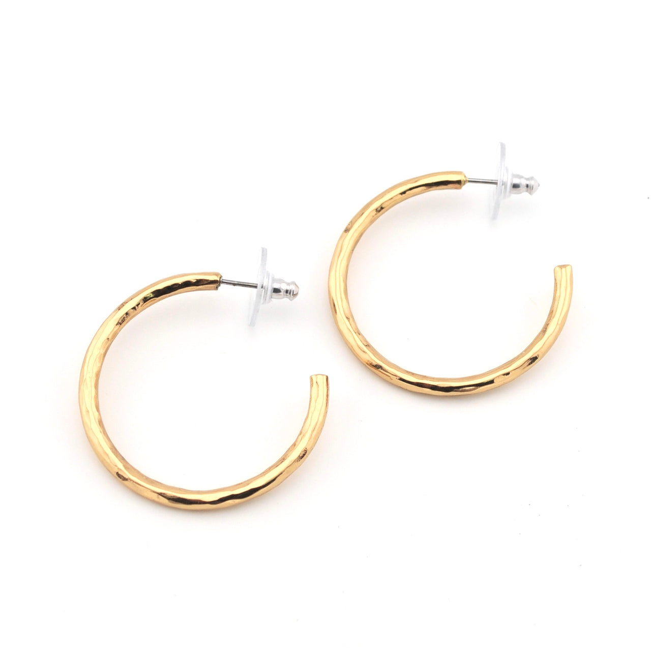 Gold hoop earrings on a white background