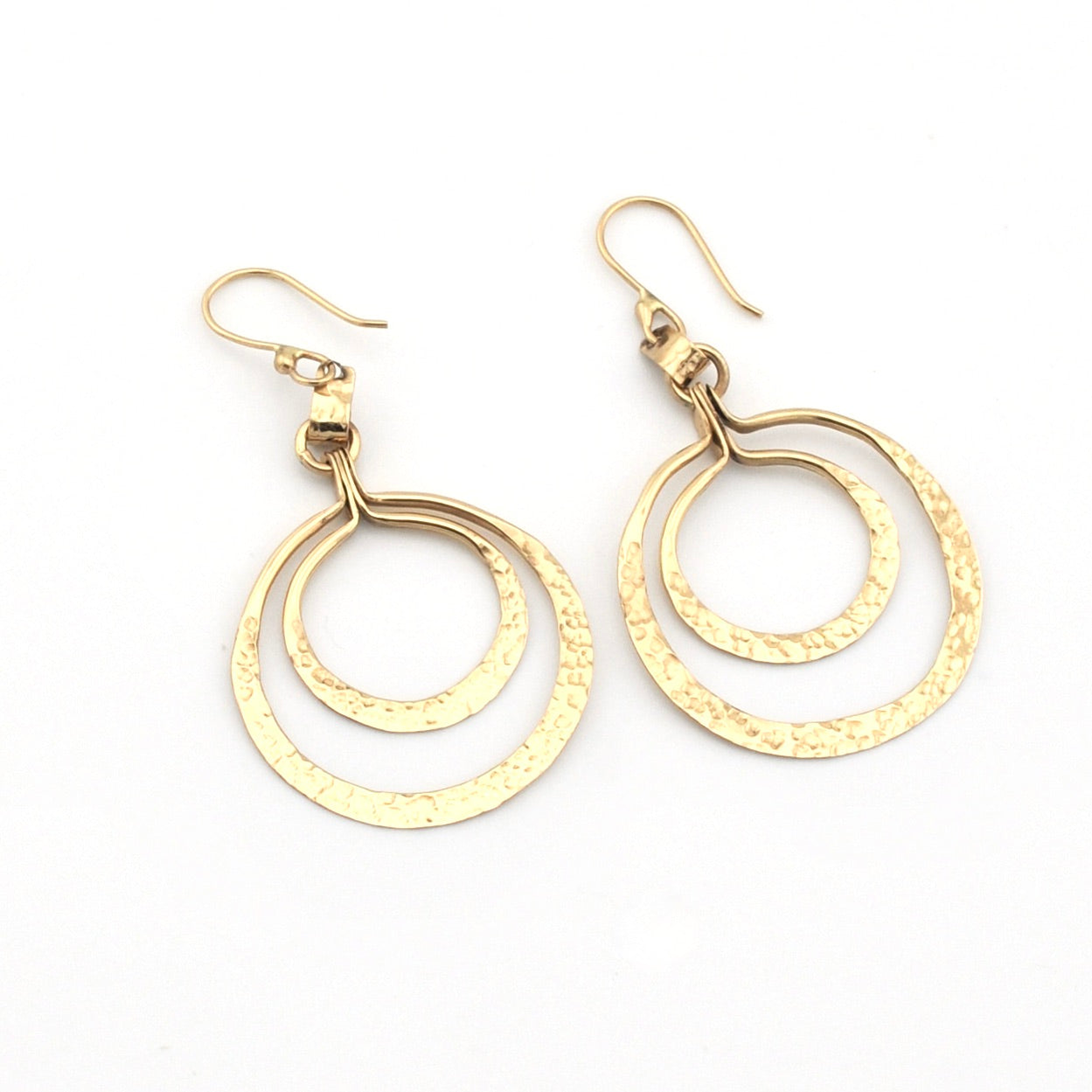 Gold hoop earrings on a white background