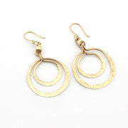 Gold hoop earrings on a white background