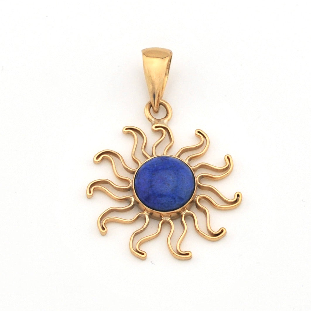 Gold sun-shaped pendant with a blue center on a white background