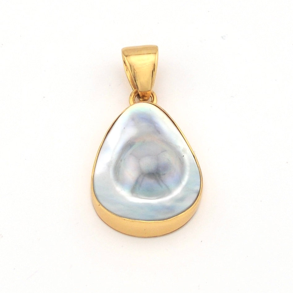 Gold pendant with a large, teardrop-shaped pearl on a white background