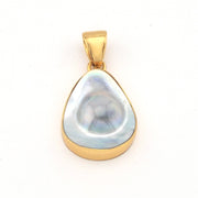 Gold pendant with a large, teardrop-shaped pearl on a white background