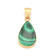Gold pendant with a green teardrop-shaped stone on a white background