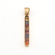 Gold pendant with multicolored design on a white background