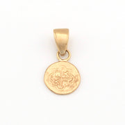 Gold pendant with a circular design on a white background