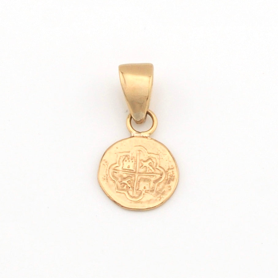 Gold pendant with a circular design on a white background