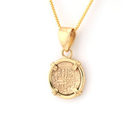 Gold pendant necklace on a white background