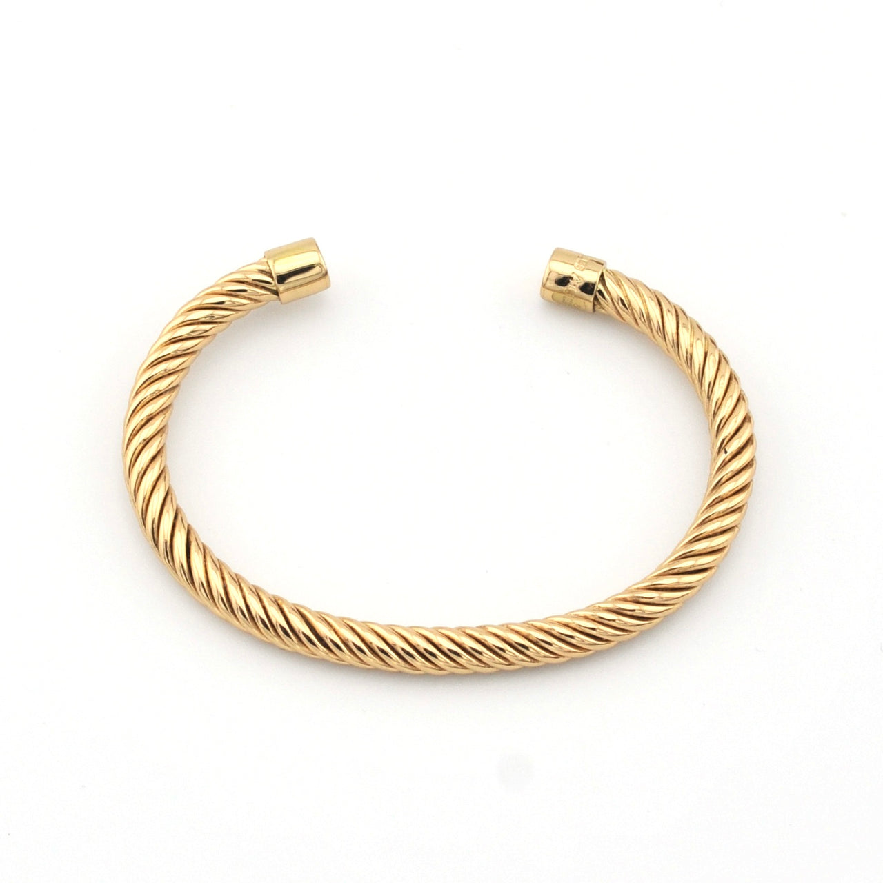 Gold bracelet on a white background