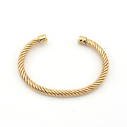 Gold bracelet on a white background