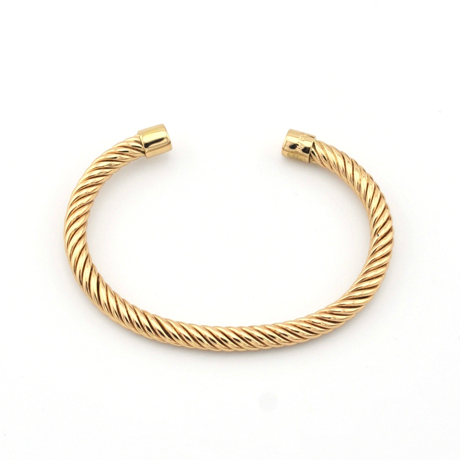 Gold bracelet on a white background