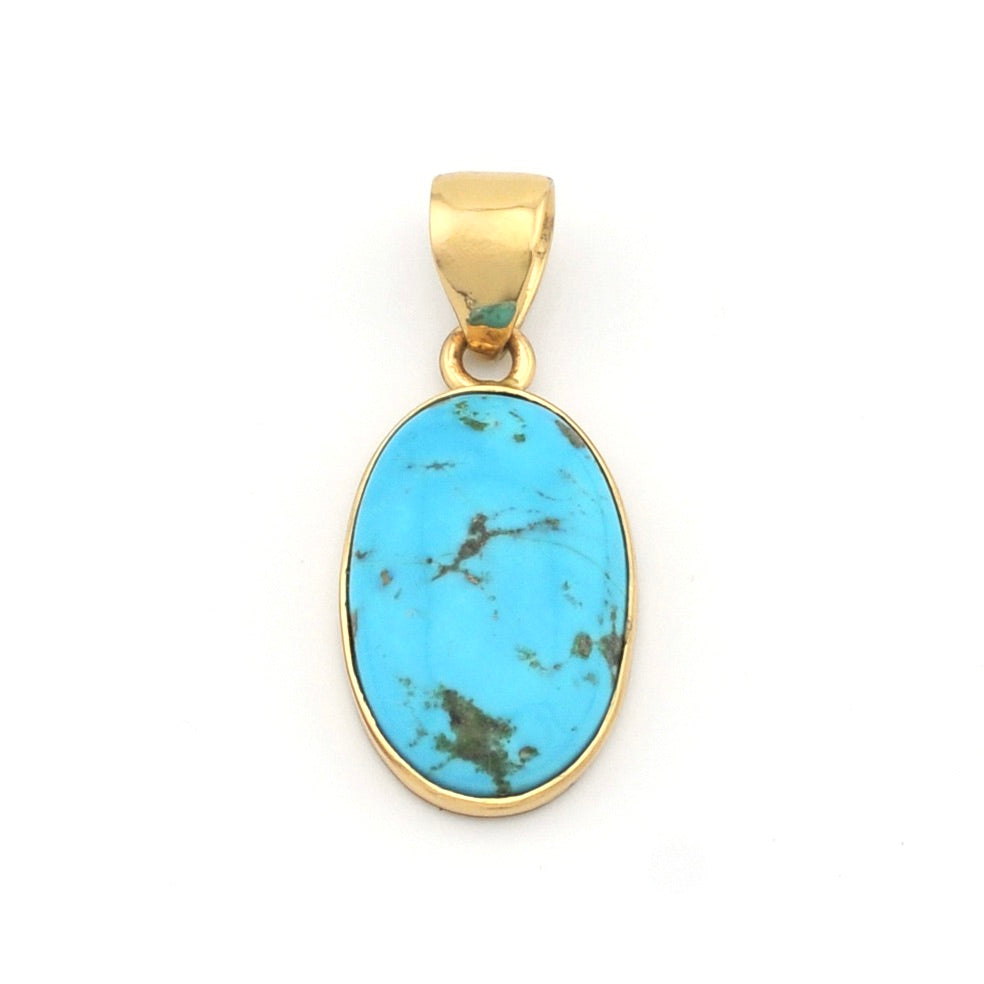 Gold pendant with a turquoise stone on a white background