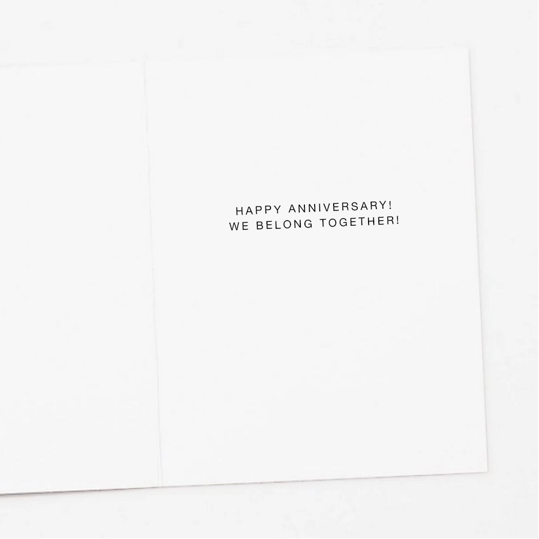 White card with black text 'Happy Anniversary! We Belong Together!' on a white background