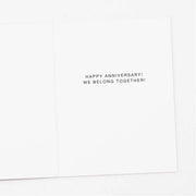 White card with black text 'Happy Anniversary! We Belong Together!' on a white background