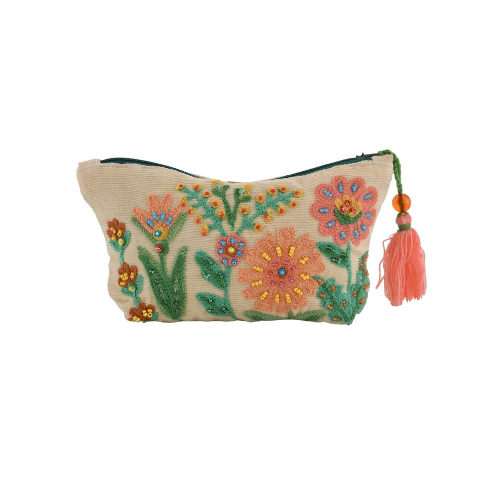 Embroidered pouch with floral design and tassel on a white background