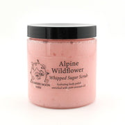 Jar of Alpine Wildflower Whipped Sugar Scrub with black lid on a white background
