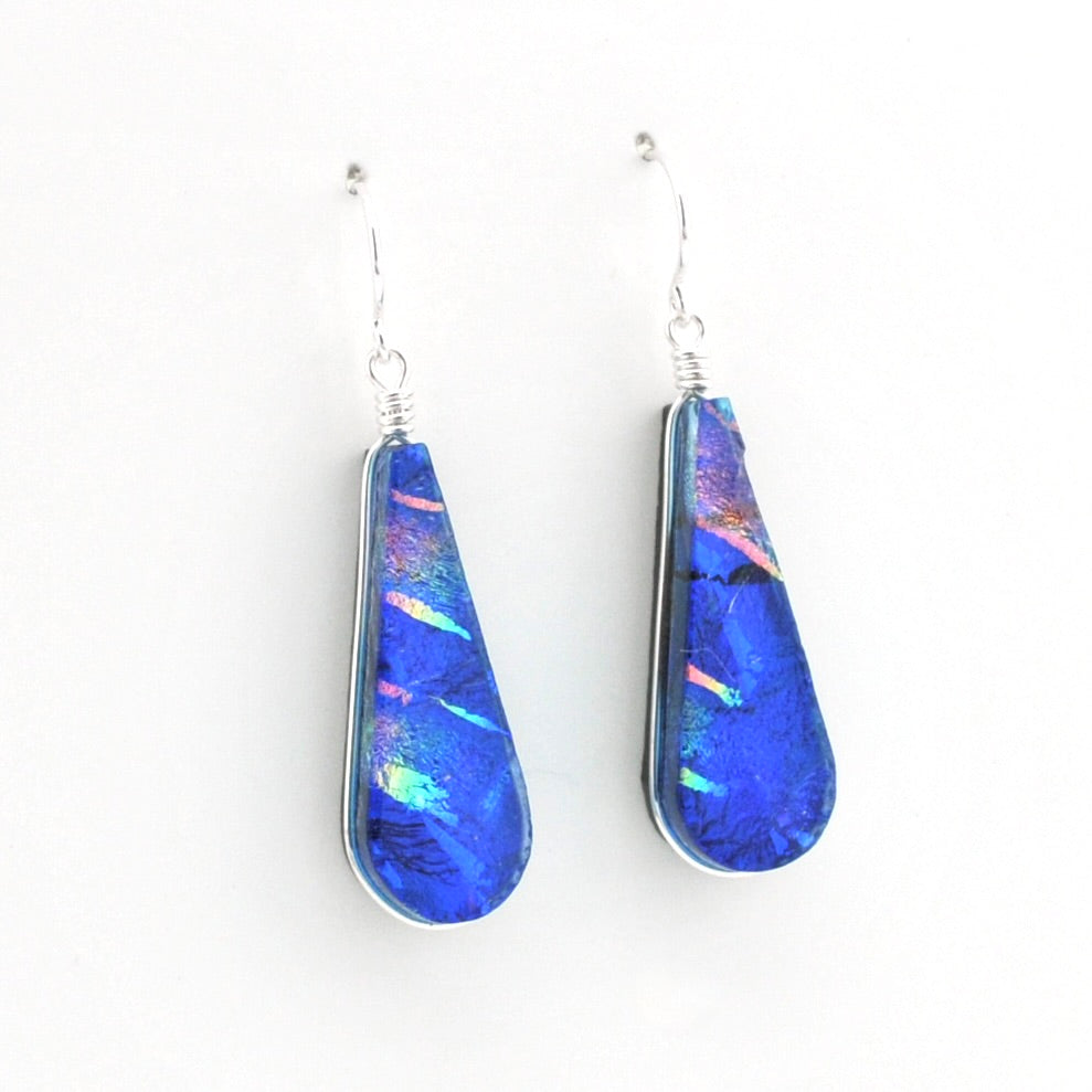Dichroic Glass Rainbow Blue Tear Earrings on white background.