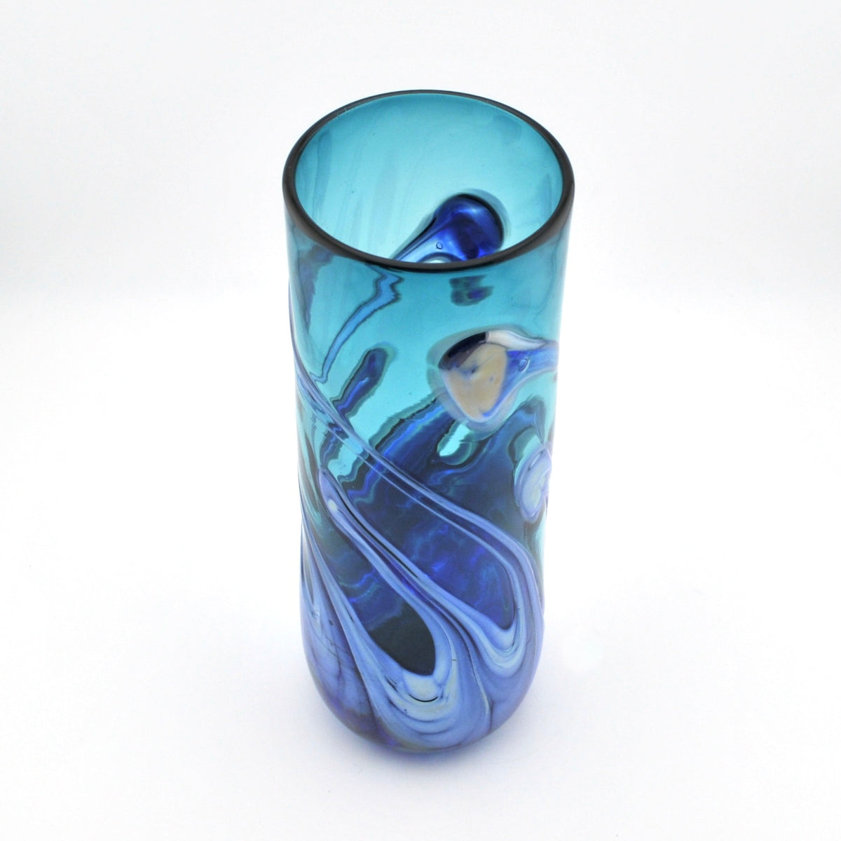 A tall, cylindrical glass vase with a swirled blue and teal pattern, photographed on a clean white background.