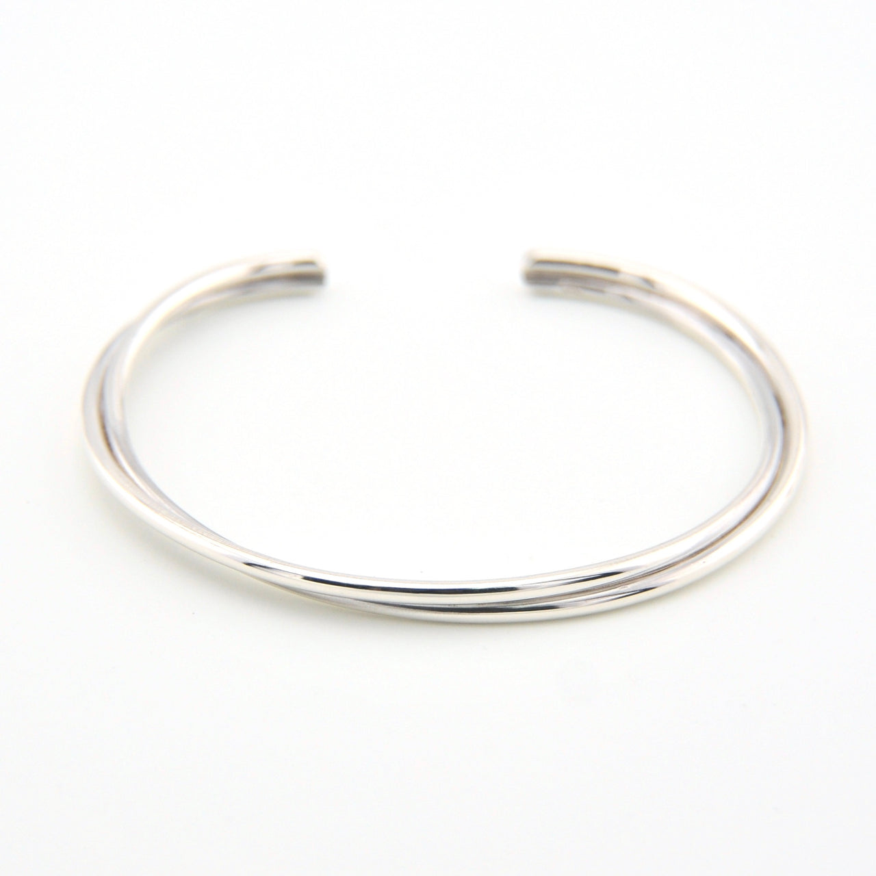 Silver bangle on a white background