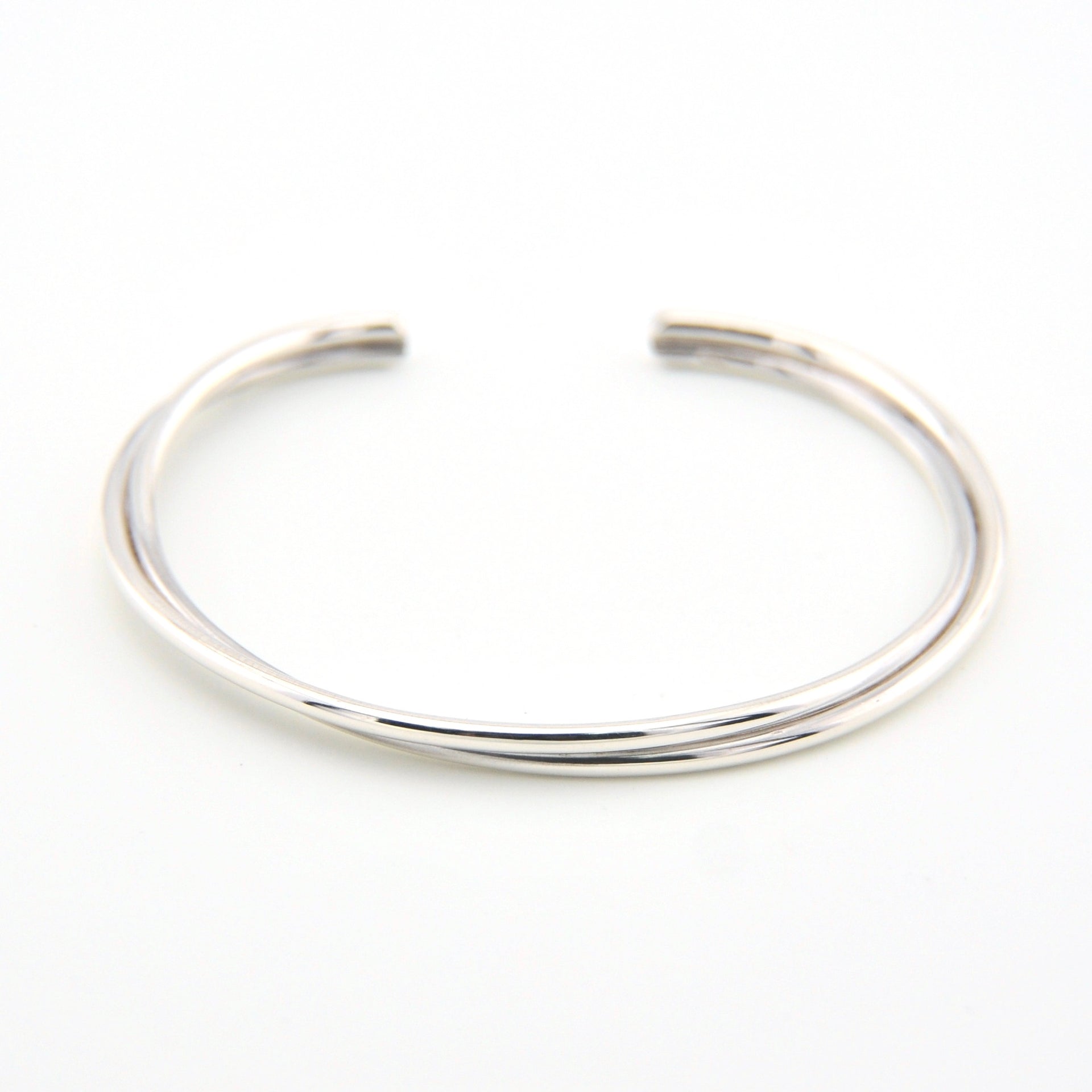 Silver bangle on a white background
