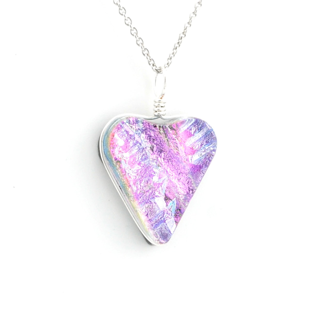 A silver heart-shaped pendant necklace featuring a vibrant, iridescent purple and pink pattern, suspended from a delicate silver chain against a plain white background.