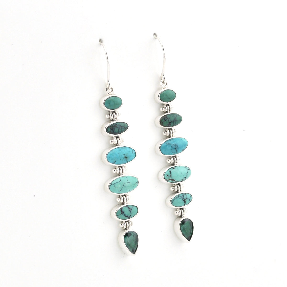 A pair of sterling silver dangle earrings featuring a vertical stack of oval and teardrop-shaped turquoise and green stone beads on a plain white background.