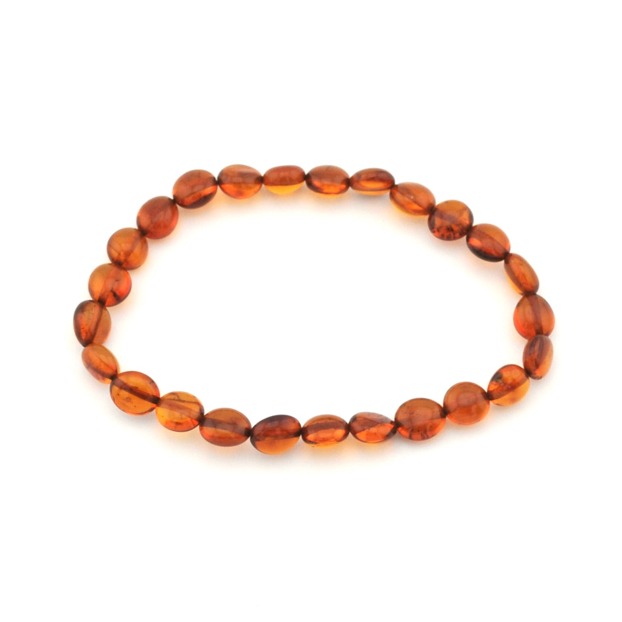 A beaded stretch bracelet made of smooth, polished oval amber beads in warm orange-brown tones, displayed on a clean white background.