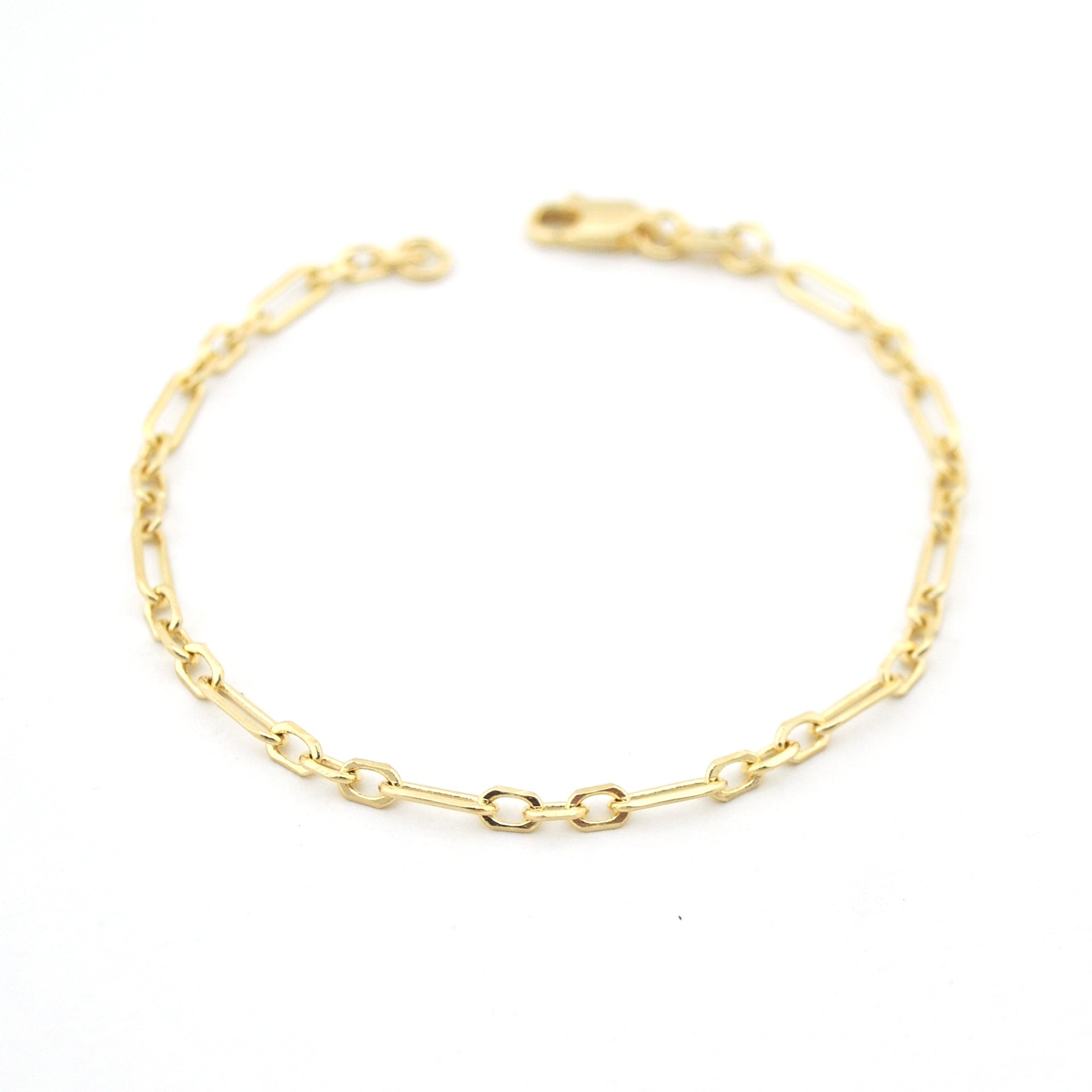 Gold chain bracelet on a white background