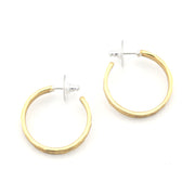 Gold hoop earrings on a white background