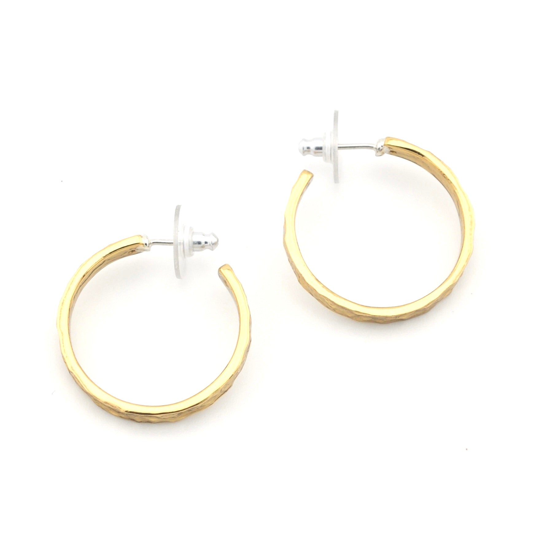 Gold hoop earrings on a white background
