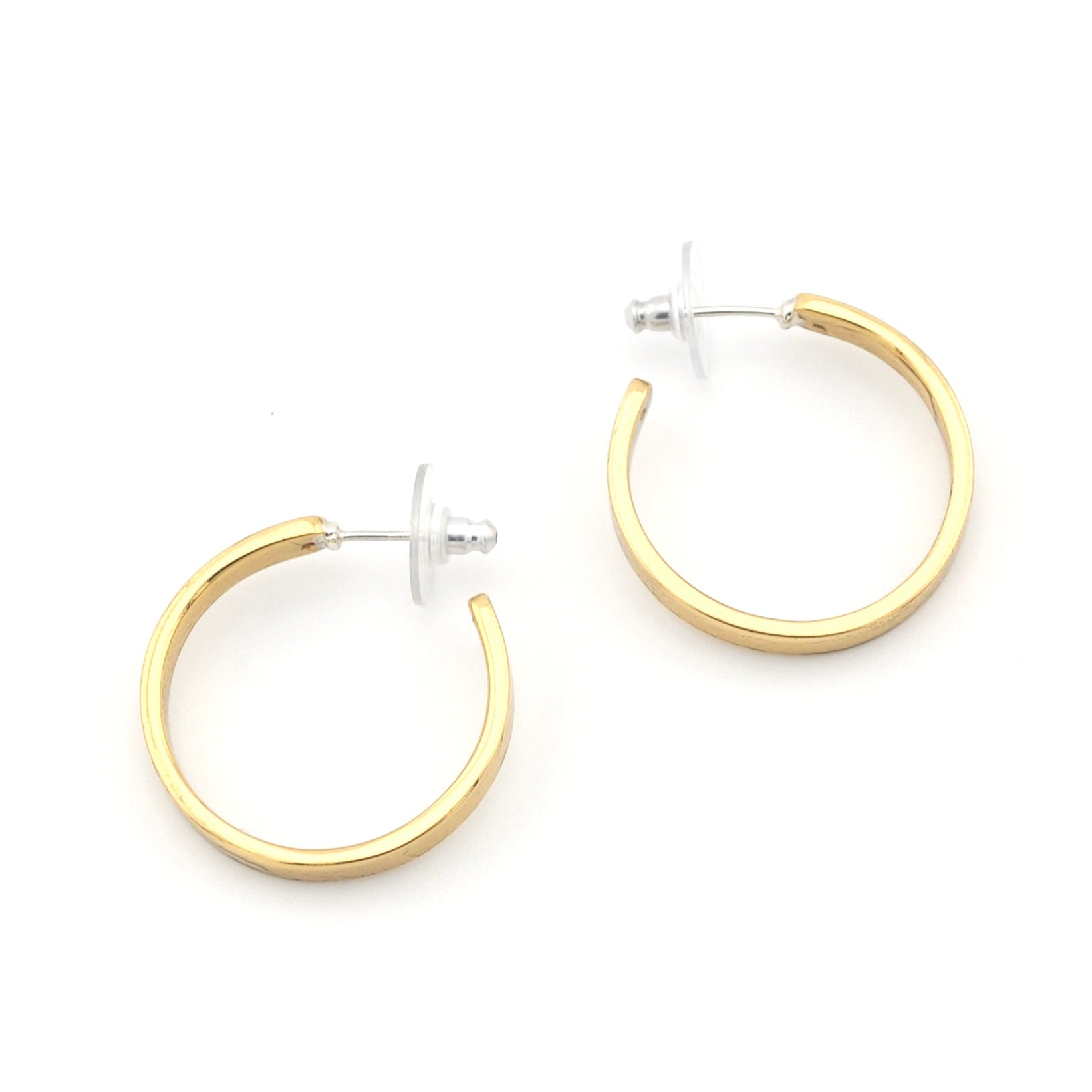 Gold hoop earrings on a white background