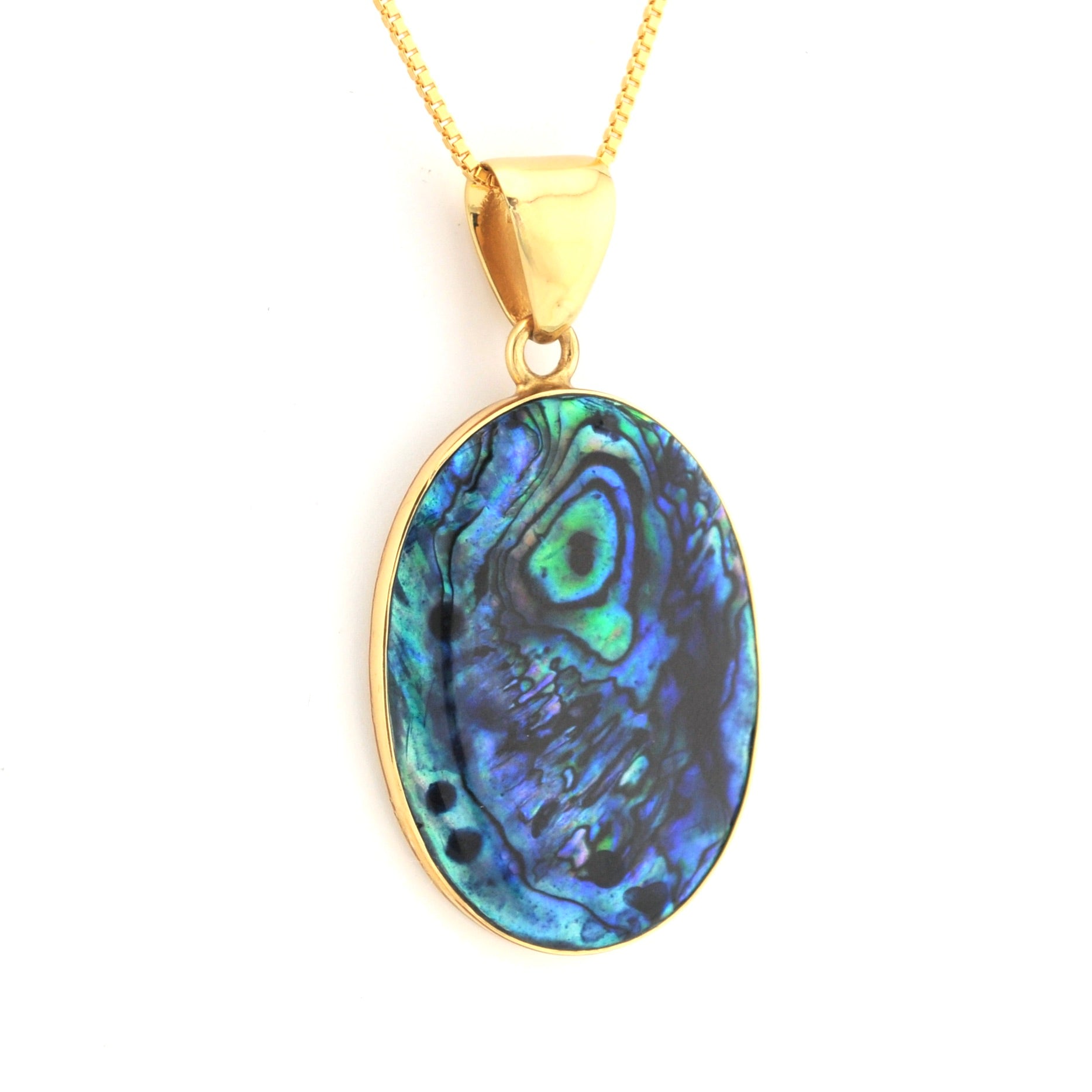 Gold pendant with a blue and green stone on a white background