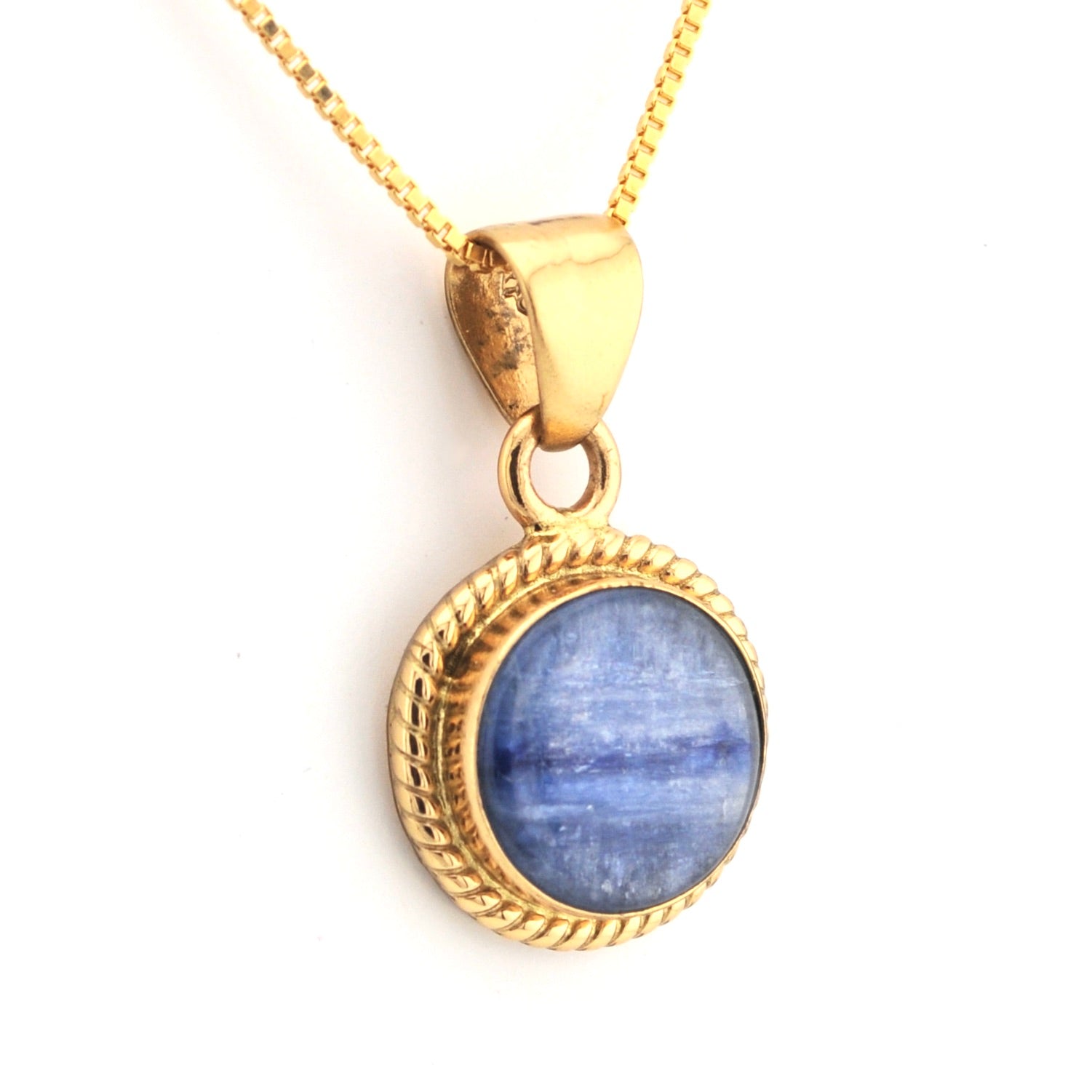 Gold pendant with a blue stone on a white background
