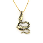 Gold snake pendant necklace on a white background