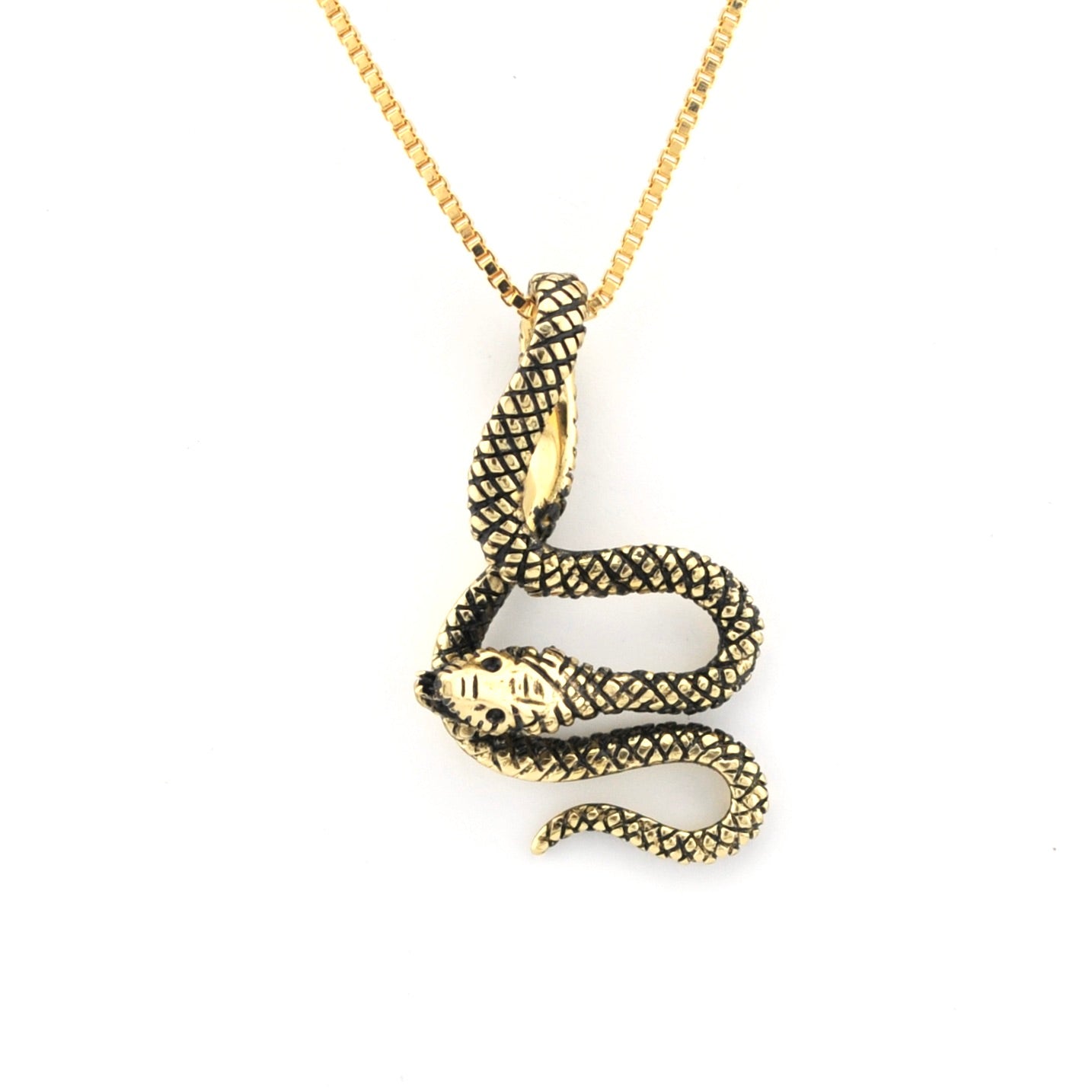 Gold snake pendant necklace on a white background