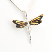 Dragonfly-shaped pendant on a white background