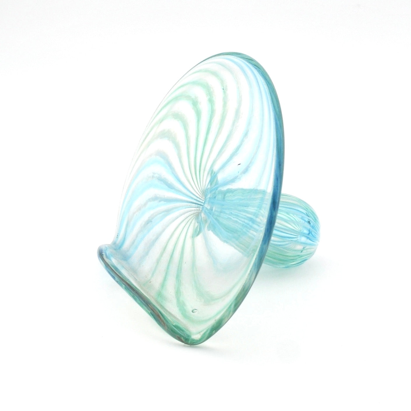 Glass object with blue and green swirl pattern on a white background