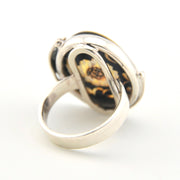 Silver ring with sunflower on a white background