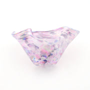 Multicolored glass bowl on a white background
