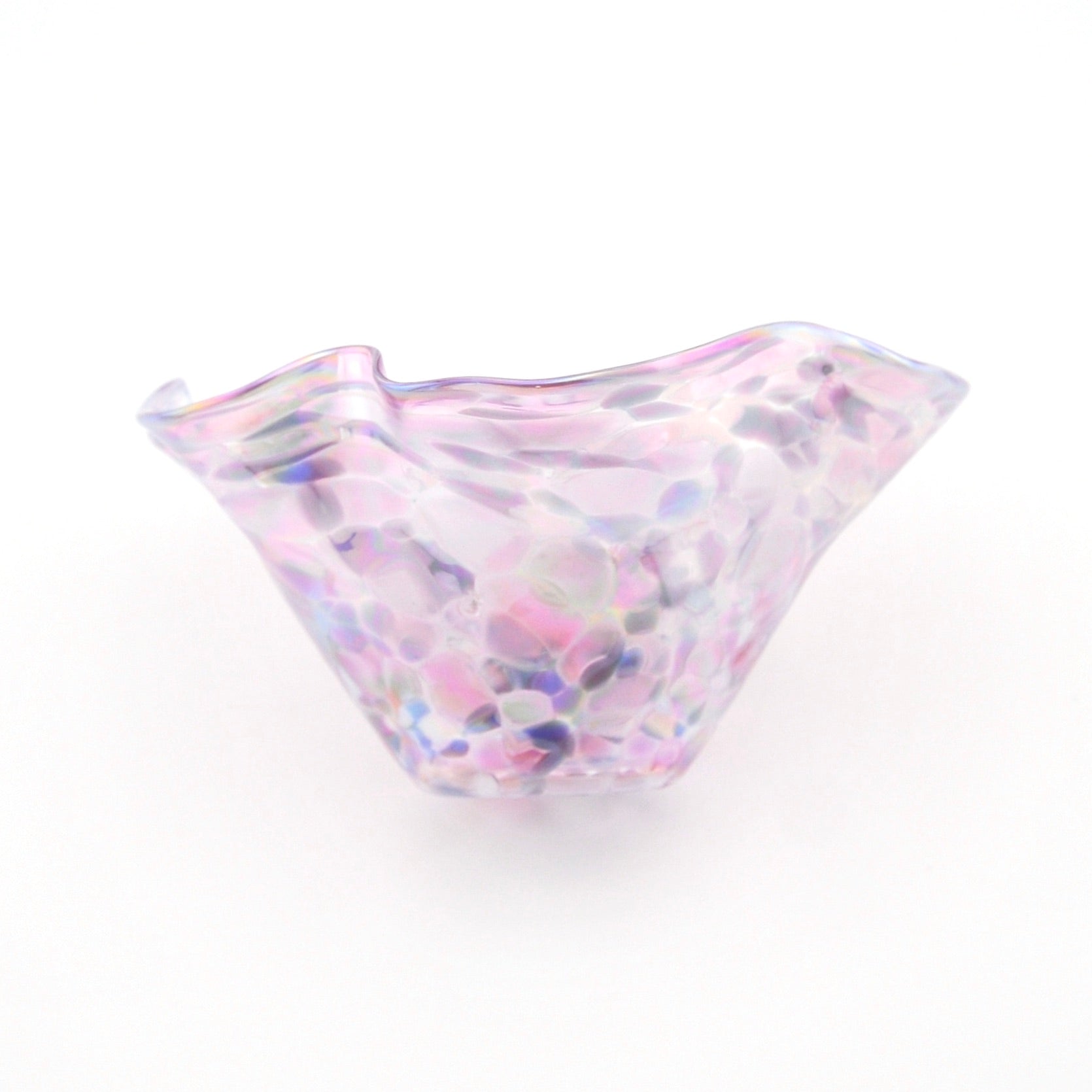 Multicolored glass bowl on a white background